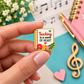 Sundry & Sound Co- Teaching Is a Work of Heart Notebook Enamel Pin